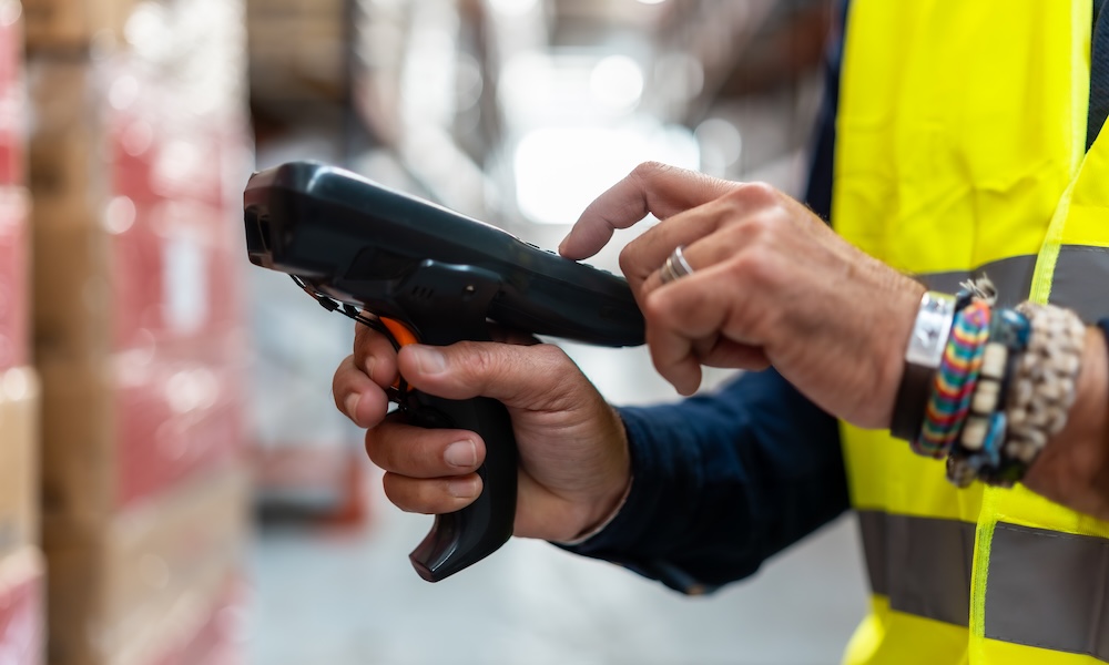 warehouse-worker-scanning-barcode-on-products-for-2026-01-11-10-50-15-utc
